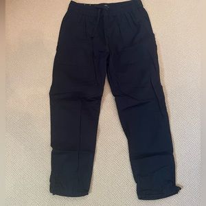 Black zanerobe pants with elastic cuff on bottom to tighten